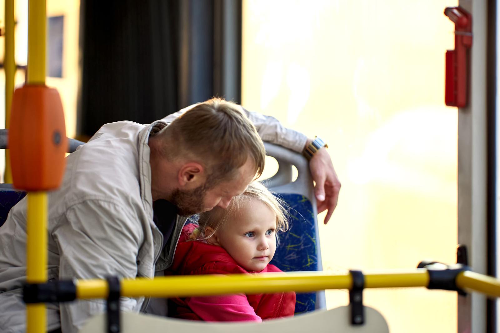 A father and child on the bus