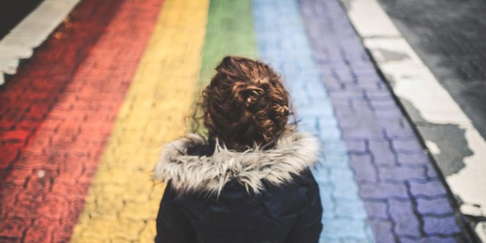 Child on rainbow cobbles