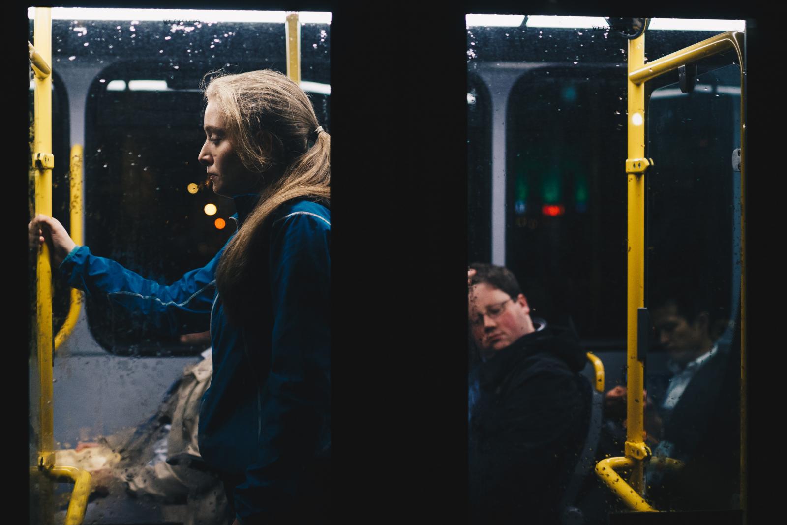 Woman standing on bus