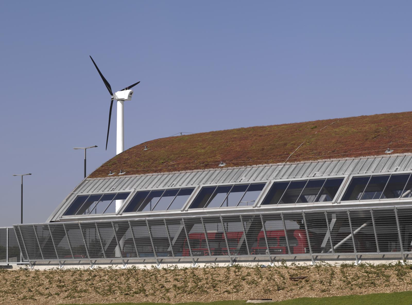 London bus shelter with green roof and wind turbine