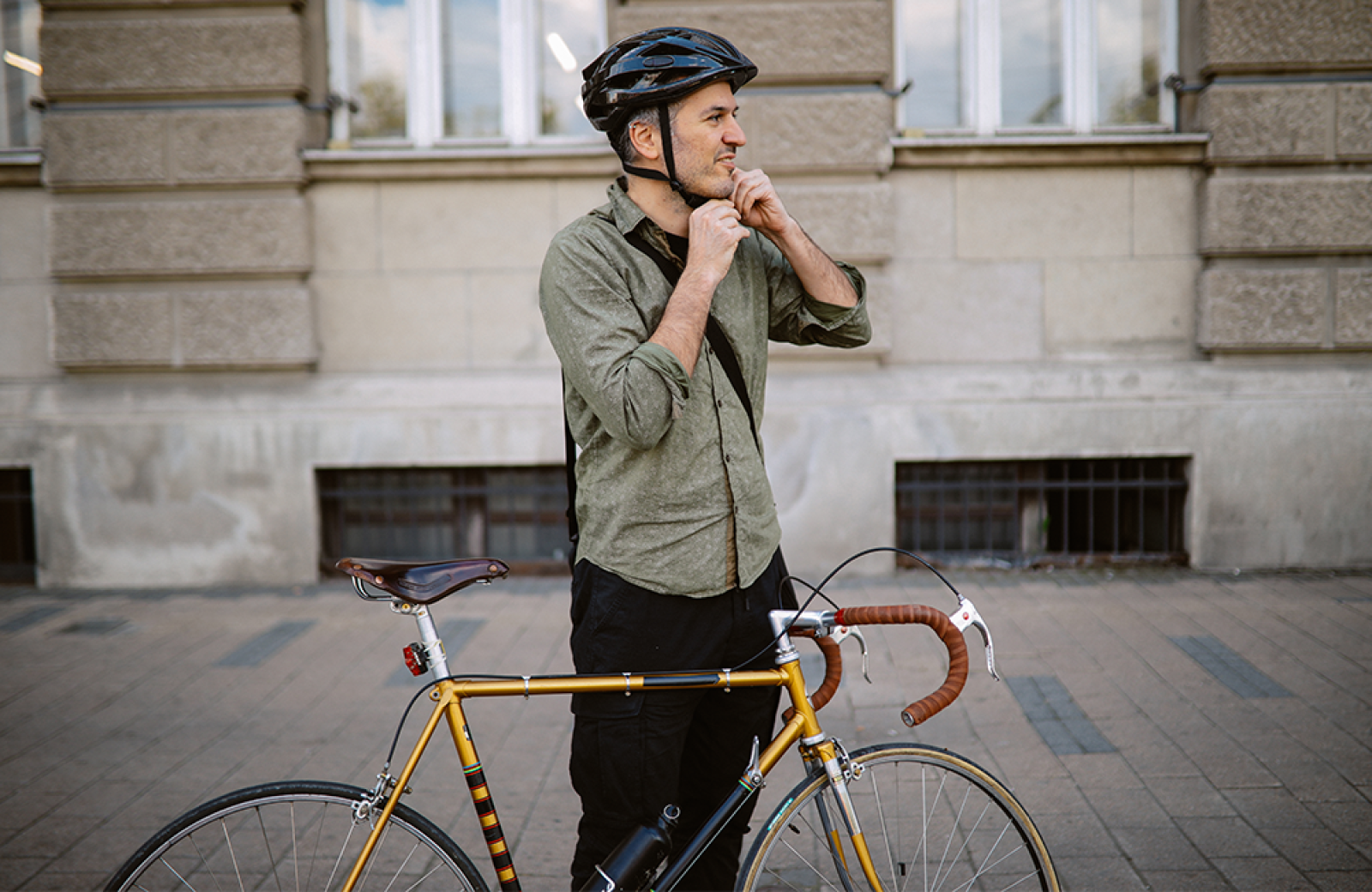 A man getting ready to ride a bike