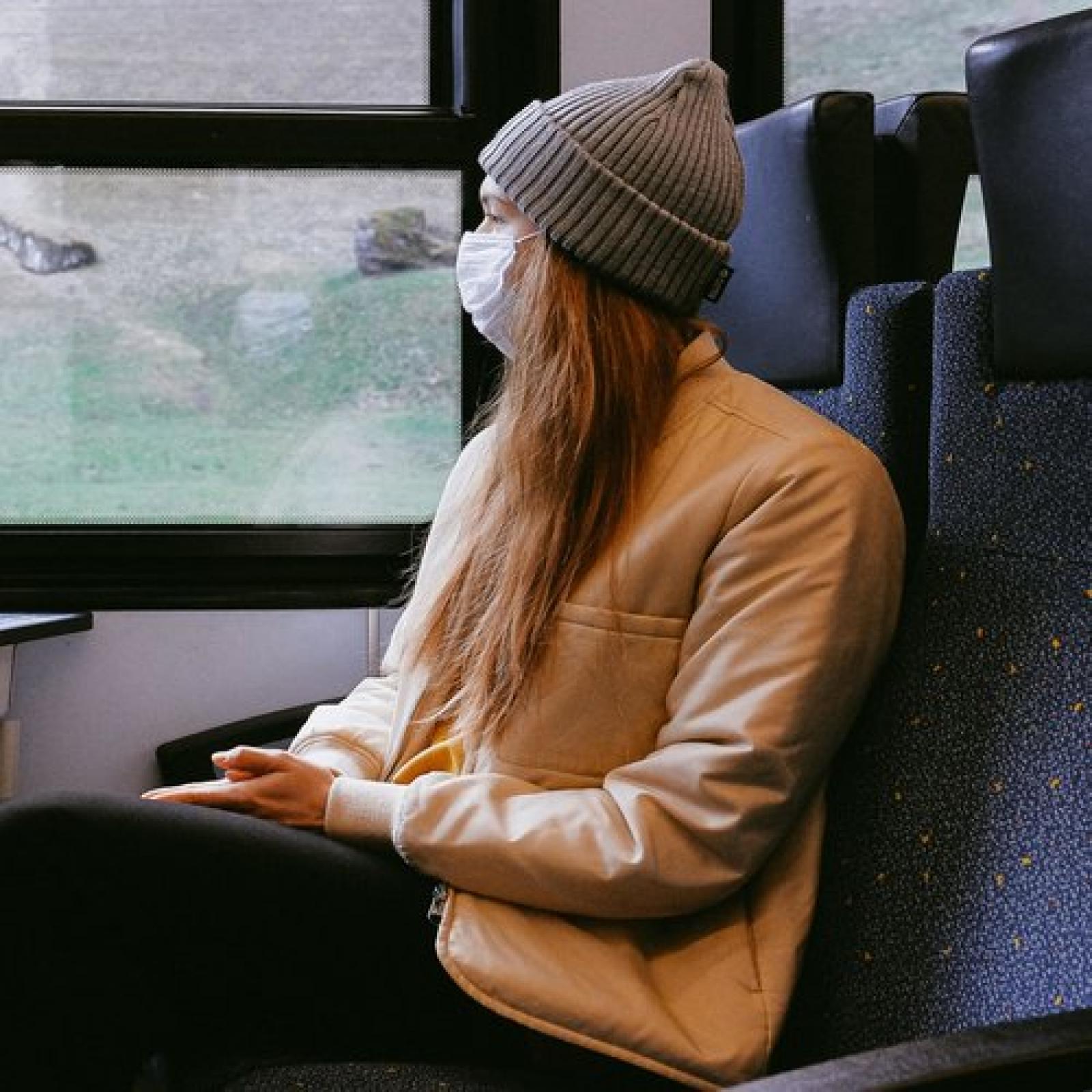 Masked woman on train
