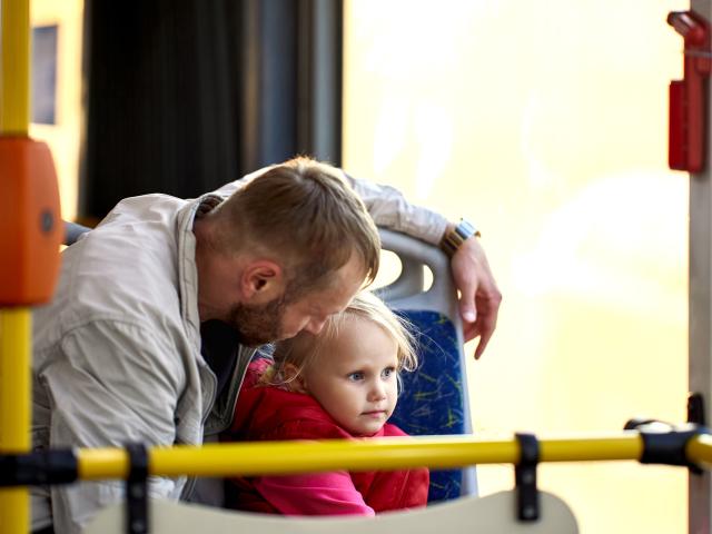 A father and child on the bus